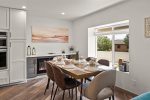 Comfortable modern dining table for 6 with a cozy electric fireplace