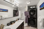 Beautifully remodeled en-suite Bathroom dual sinks & stackable washer & dryer.