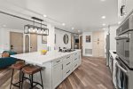 Fully-fitted with modern appliances and kitchen amenities.