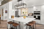 The kitchen area is open plan with plenty of space and a large island