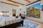 Primary guest bedroom with peaceful views