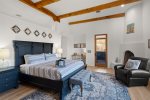 King bed, cozy gas fireplace, workspace, and direct access to a private patio