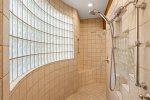 Spacious walk in shower with dual shower heads