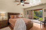 The 2nd guest bedroom also offers a plush king-size bed and backyard patio access