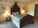 The master bedroom is beautifully furnished with a queen size bed