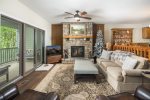 beautiful wide plank wood floors, stone fireplace