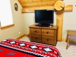 Master bedroom off the loft with walk out deck