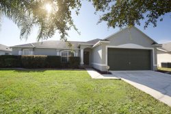 Relax poolside overlooking a Florida conservation area and small lake at this lovely villa in a gated community!