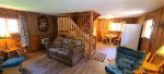 Living room has all you need for a family of 4 including the fireplace.
