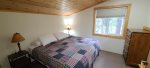 One of the upstairs bedrooms has a king bed.