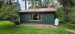 Knotty pine cabin walking distance to River, lake and activities.