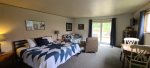 Open flloor plan with a king bed and living room.