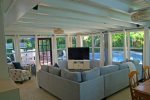 Family Room with decorative wood beamed ceiling.