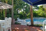 Raised Fire Pit & Dining Area adjacent to Swimming Pool & Hot Tub.