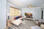 Living Room with Flat Screen TV and Full Window Covering