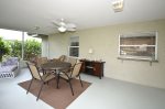 Screen Enclosed Patio with Dining table for four.