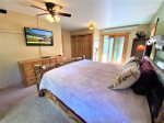 Master bedroom with King bed, TV, attached bathroom, deck access
