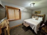 Lower level Bedroom 2 with queen and twin bunks