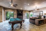 Family Room Has Billiard Table, TV, Gas Fireplace & Opens to Backyard