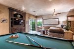 Family Room Has Billiard Table, TV, Gas Fireplace & Opens to Backyard