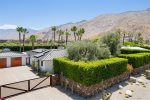 Gated and Hedged Private Front Yard With Three-Car Motorcourt