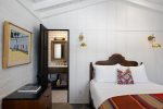 Bedroom Three Features Queen Bed, En Suite Bath, Built-in Desk Overlooking Pool