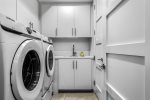 Laundry Room With Washer Dryer and Sink