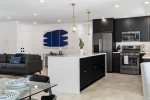 Fully-Equipped Kitchen With Large Island Is Family-Room Adjacent