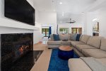 Family Room Features 75 Inch TV & Fireplace