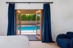 King Bed, 65 Inch TV, Ensuite Bath, Walk-In Closet, Door To Pool In Primary Bedroom