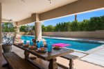 Expansive Covered Patio Features Outdoor Dining For Eight