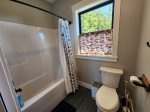 Main bathroom upstairs with a bathtub