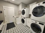Laundry room with 2 sets of washers and dryers