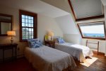 Upstairs twin bedroom with ocean views - has window AC unit