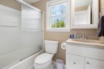 Primary bathroom with shower and bath tub