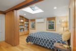 Upstairs bedroom with skylight for natural day light