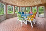 Enclosed 3-Season porch is the perfect gathering spot