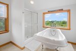 Enjoy a relaxing soak in the tub overlooking the bay 