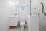 Ensuite bathroom with stand-up shower off primary bedroom