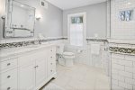 Spacious ensuite with bright, modern accents