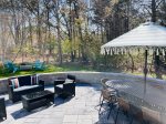 Private backyard with ample seating, dining table, grill and private outdoor shower