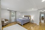 First floor bedroom with a queen bed and gorgeous wood floors