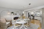 The kitchen connects to an additional dining area