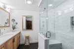 Luxurious glass shower with a bench seat