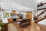 The eat-in kitchen boasts stainless steel appliances