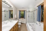 Jetted tub, glass walk in shower, and double vanities in the ensuite bathroom