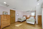 Adorable pink bedroom with two twin beds