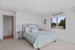 Queen bed and a twin bed in the final upstairs bedroom