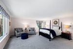 Spacious primary bedroom on the first floor with an olympic queen bed