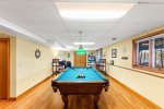 Lower level game room with a pool table